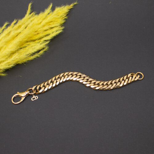 Dior massives goldenes Panzerarmband Front