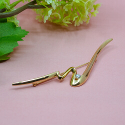 große goldene Brosche von Pierre Lang Seite