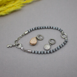 Skagen Unisex Cat-Eye Perlen Armband mit 2 Charms Bild 2 Skargen Armband mit 2 Charms liegend