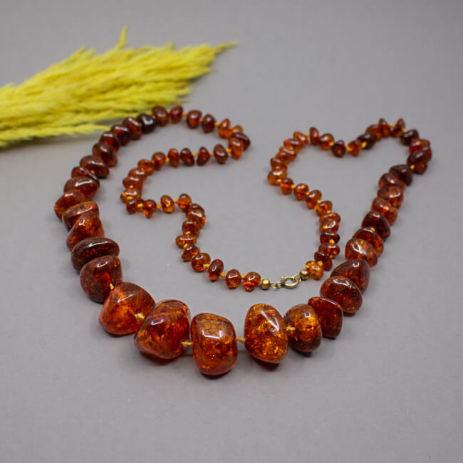 Bernsteinkette honigfarben, 107 cm von Groß - Klein Bild 1 Vintage Bernsteinkette cognagfarbe Front